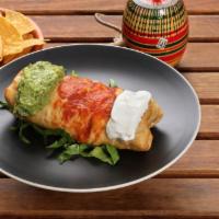 Chimichanga · Meat, Cheese, Beans, Guacamole, Sour Cream and Enchilada Sauce.