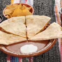 Quesadilla · Flour Tortilla with Cheese and Pico de Gallo inside and Sour Cream on the side.