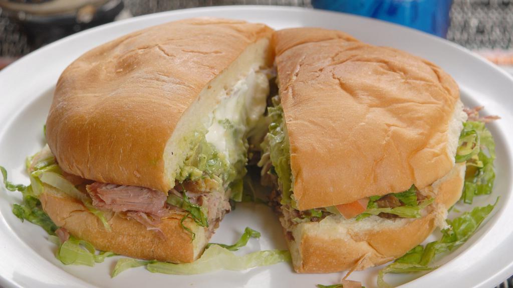 Torta · Meat of your choice, Lettuce, Sour Cream, Guacamole, Pico de Gallo and Jalapeños all in our exclusive Torta bread.