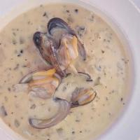 New England Clam Chowder · Baby manila clams, Yukon gold potatoes, celery, onion with a hint of bacon in a white wine c...