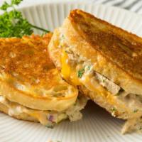Tuna Cheddar Melt Sandwich · Fresh, delicious sandwich topped with Tuna, melted cheddar cheese, and tomato slices. Served...