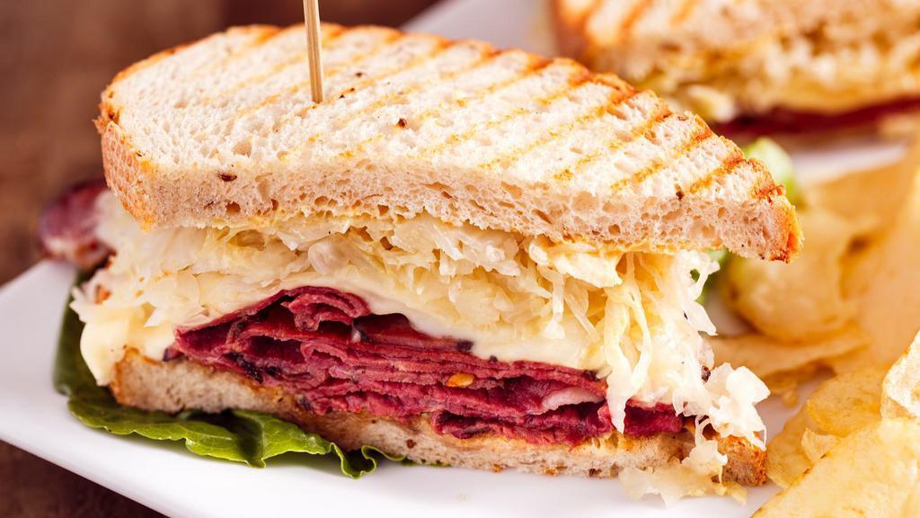 Reuben Sandwich · Fresh, delicious sandwich topped with Corned beef, sauerkraut, and Thousand Island dressing, served on toasted light rye bread.