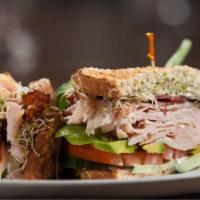 Turkey Club Sandwich · Fresh, delicious sandwich topped with Turkey, crispy bacon, lettuce, tomato, and mayo on 3 s...
