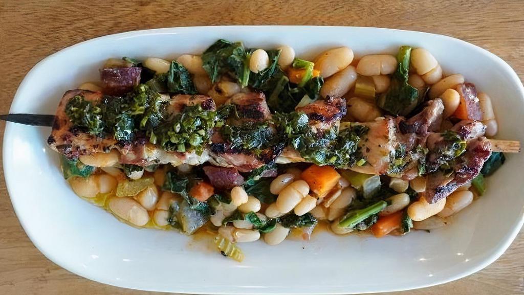 CHICKEN SPIEDINI (skewers) · two rosemary, thyme, and garlic marinated chicken thigh skewers - grilled and served over cannellini beans in a smoked pancetta stew