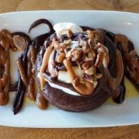 FLOURLESS CHOCOLATE CAKE · warm chocolate cake and vanilla gelato with pecan nuts, whiskey caramel and chocolate sauces...