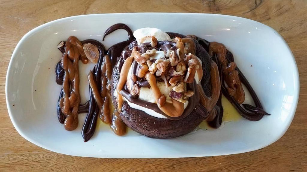 FLOURLESS CHOCOLATE CAKE · warm chocolate cake and vanilla gelato with pecan nuts, whiskey caramel and chocolate sauces  *gluten *dairy *alcohol