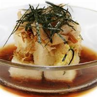 Age-Dashi Tofu · Tofu steaks deep fried and garnished with itokake and nori in a sweet ginger soy sauce.