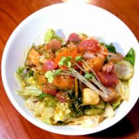Chef's Poke' Salad · Mixed sashimi, sweet onion, cucumber, seaweed salad, roasted, almonds, aioli in vinaigrette ...