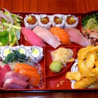 Sushi Bento · 4pcs spicy tuna and California roll, 4pcs
sushi, 6 pcs sashimi, mix tempura, special 
salad.