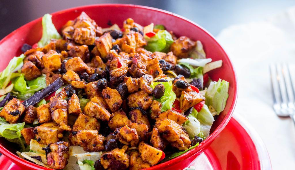 Grilled BBQ Chicken · Black beans, sweet corn, tomato, cilantro, basil, shredded cheese, crispy corn tortillas, romaine, warm BBQ chicken and our herb ranch dressing.