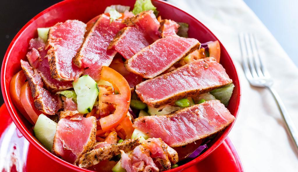 Ahi Tuna · Freshly seared and grilled Ahi tuna, lettuce, shredded carrots, cucumber, edamame and balsamic dressing.