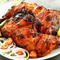 Tandoori Chicken Leg · Chicken leg marinated in spices and herbs and cooked in traditional clay oven.
