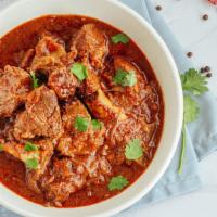 Lamb Vindaloo · Marinated lamb in a spiced curry sauce with potatoes