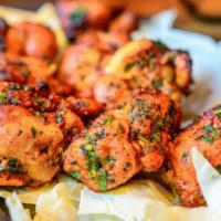 Tandoori Chicken Breast · Chicken leg marinated in spices and herbs and cooked in traditional clay oven.