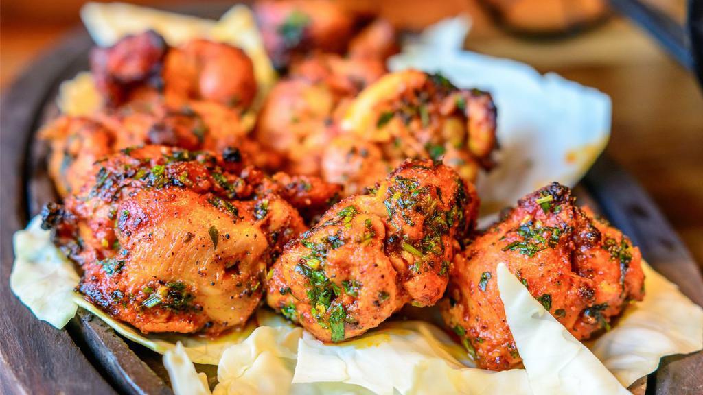 Tandoori Chicken Breast · Chicken leg marinated in spices and herbs and cooked in traditional clay oven.
