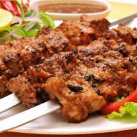 Chicken Tikka Kebabs · Boneless pieces of chicken marinated in indian herbs and cooked in the clay oven. Served wit...