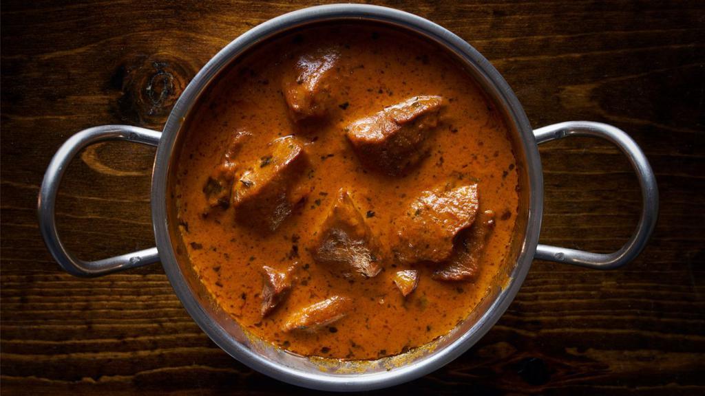 Lamb Tikka Masala · Fresh pieces of tender lamb baked in clay oven and slowly cooked with tomato and onion cream sauce.