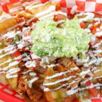 Ma' Cho Nachos · Housemade Corn Tortilla Chips topped with your choice of Grilled Chicken or Spicy Pork, Melt...