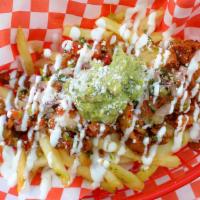 Ma' Cho Fries · French Fries topped with your choice of Grilled Chicken or Spicy Pork, Melted Jack Cheese, S...