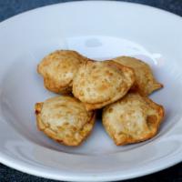Cream Cheese Crab Puff · Imitation crab-meat, cream cheese and onion in wonton skin, fried to crispy.