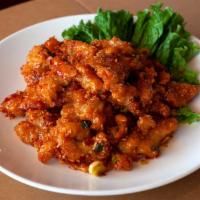 Chili Chicken · Crispy chicken sauteed with sweet garlic chili sauce, Spicy level two.
