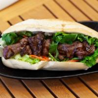 Grilled Beef Tenderloin Banh Mi Sandwich · Grilled Filet Mignon with a choice of banh mi sandwich or zhua bing wrap