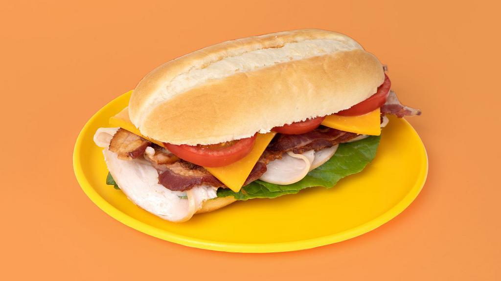 Turkey Bacon Club · Turkey, bacon, lettuce, tomato, onion, and mayo on bread.