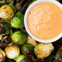 Brussels Sprouts · Crispy Fried Brussl Sprouts with lemon, garlic, butter, capers and Sriracha Dipping Sauce