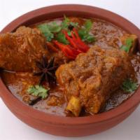 Goat Curry · Artfully Cut Goat Made into a Delicious Curry.