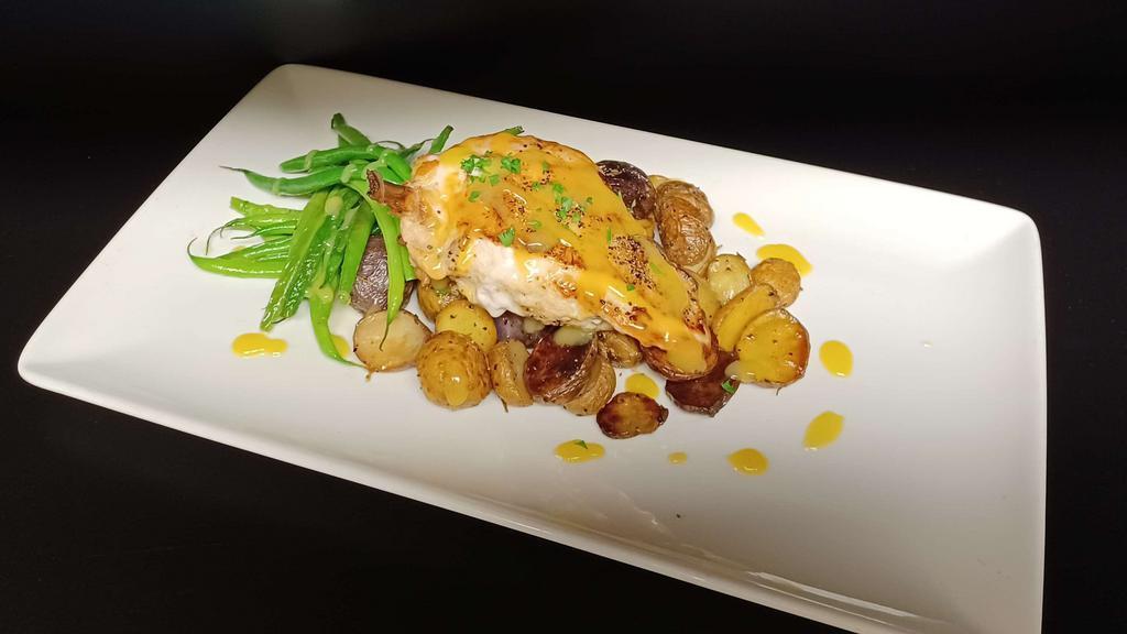 Roast Chicken Breast · Roasted 8 ounce airline chicken breast served with green beans and roasted baby potatoes in a lemon pan sauce