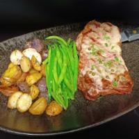 12-ounce N.Y. Steak · 12 ounce NY strip steak grilled to order, served with green beans, roasted baby potatoes and...