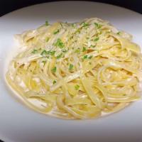 Fettucine Alfredo Pasta · Fettucine pasta tossed in a garlic cream sauce and parmesan cheese