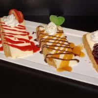 Classic N.Y. Style Cheesecake Flight · Blueberry - Chocolate & Caramel - Strawberry
Vanilla whipped cream