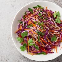 Spicy Rainbow Slaw · A spicy, fresh slaw with red and green cabbage, green onion, cilantro, pickled peppers, onio...