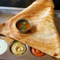 Mysore Masala Dosa · Spiced crepe with potatoes smeared inside with spicy chutney. Served with sambar and coconut...