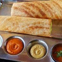 Sada Dosa · Thin crepe made from rice and lentil. Served with sambar and coconut chutney.