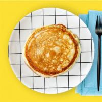 LABC Pancakes · Two fluffy pancakes served with a side of butter and syrup. Morning sunshine.