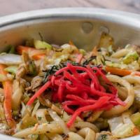 Udon Sautée · Stir fried thick noodles with pork and vegetables.