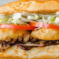 957. THE DAMON BRUCE · Steak, Steak Sauce, Beer-Battered Onion Rings, Provolone. All sandwiches are served hot with...