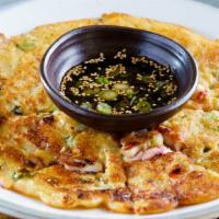 Seafood Pancake (해물전) · Traditional Korean style seafood (squid, mussel, and clam) pancake prepared with flour batter.
