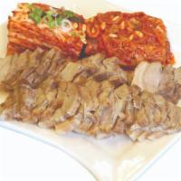Korean Steamed Pork (BoSsam) 보쌈 · Steamed Pork with Kimchi (prepared with raw oysters) and served with Korean dipping house sa...