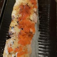Lion King  · real crab meat, avocado, top w/salmon & garlic sauce, torched, tobik