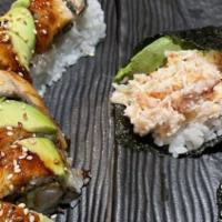 Dragon  · shrimp tempura, cucumber, top w/bbq eel, avocado & sesame