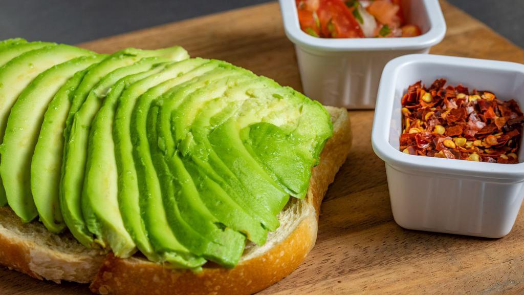 Avocado Toast · Toasted Slice of Bordenave Sour Dough with Avocado served with chili flakes, pico de galo on the side.