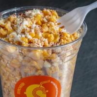 Esquite 12 oz · Cup of corn kernels fresh off the cob mixed with mayo, cotija cheese,  salt, lime & chili po...