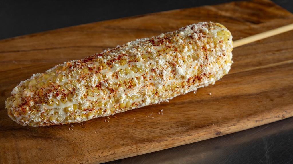 Elote Stick · Corn on the Cob on a stick with mayo, cotija cheese, tajin.