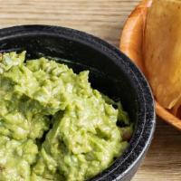 Guacamole & Chips · A heaping scoop of fresh guacamole (avocado, tomato, onion, cilantro, lime juice, salt) with...