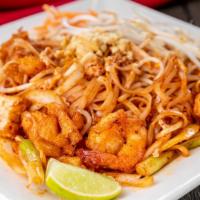 63. Pad Thai · Rice noodles stir with chicken, shrimp, egg, tofu, cabbage beansprout and peanut.