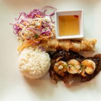 Combination Rice Plate · Grilled pork, prawns, imperial roll, spring mix and nuoc Cham.