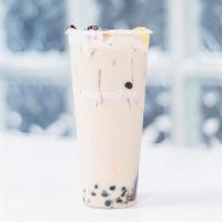 QQ Milk Tea · Classic black milk tea with a little bit of every topping. Toppings include: boba, lychee je...